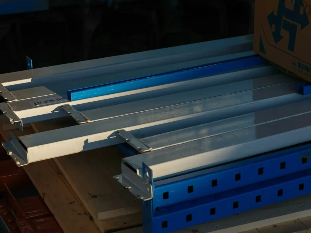 A close up of a metal shelf with a box on top of it